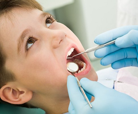 Young child receiving a dental exam