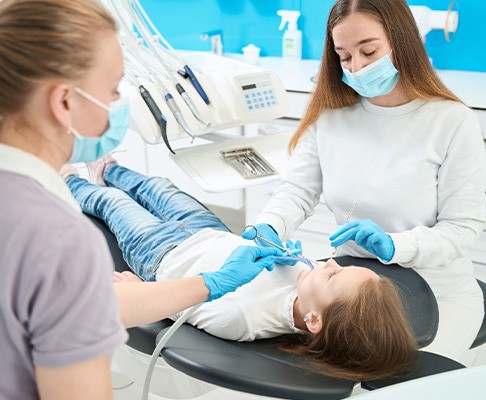Child undergoing dental crown treatment