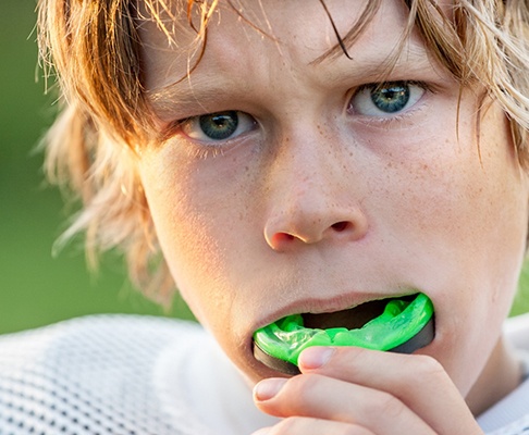 A boy with an athletic mouthguard