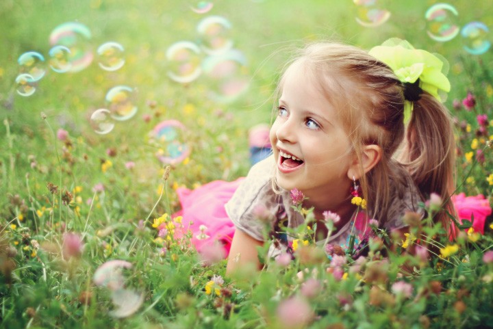 girl smiling in field