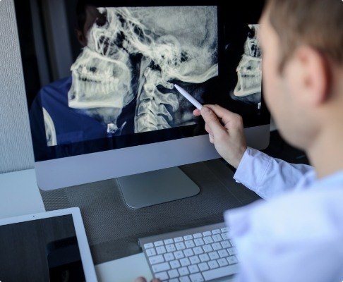 Dentist reviewing digital x-rays