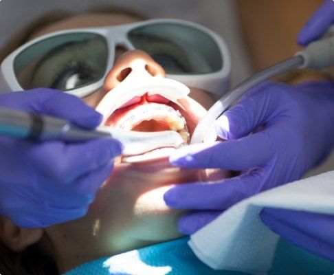 Patient receiving dental laser treatment