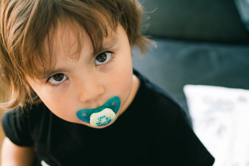 toddler with a pacifier