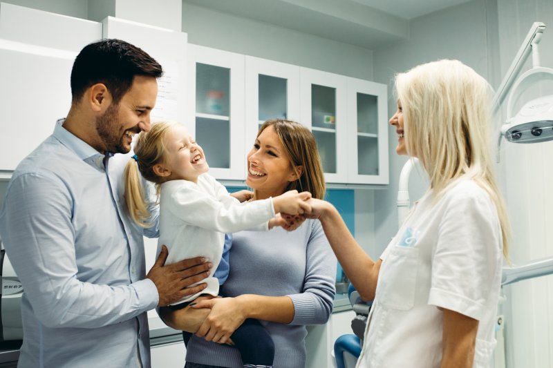 Child smiling at the dentist during Children’s Dental Health Month