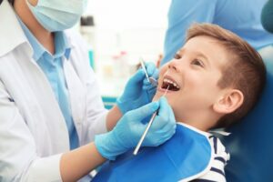 Dentist working on child.