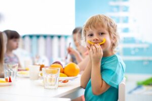 Child eating bell peppers